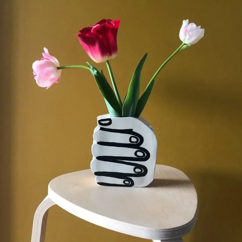 Hand Holding Flowers Vase