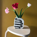 Hand Holding Flowers Vase