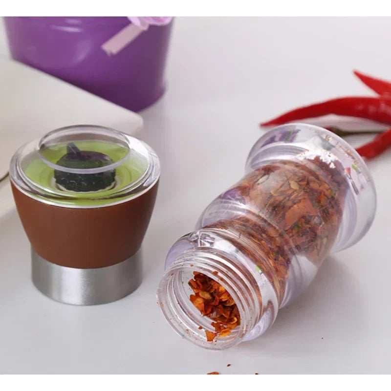 Classic manual grinder with a transparent housing that highlights the flavor