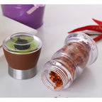Classic manual grinder with a transparent housing that highlights the flavor