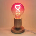 Pink LED light bulb with heart pattern – gradient