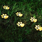 Solar lamp in paw print design – LED garden lighting in multicolor for outdoor use
