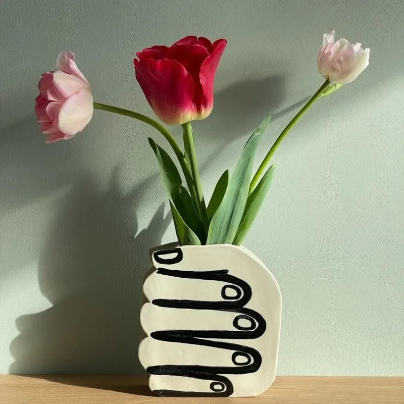 Hand Holding Flowers Vase