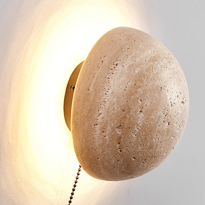 Cream wall lamp in Scandinavian style providing cozy light and elegant simplicity