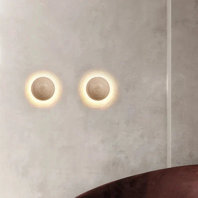Cream wall lamp in Scandinavian style providing cozy light and elegant simplicity