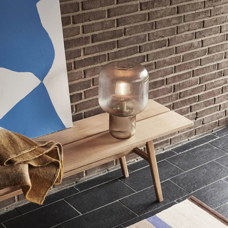 Stylish lamp with a noble finish