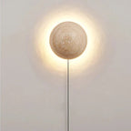 Cream wall lamp in Scandinavian style providing cozy light and elegant simplicity