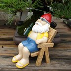 Sunbathing Gnome Statue made of Resin with Lounger for Garden Decoration