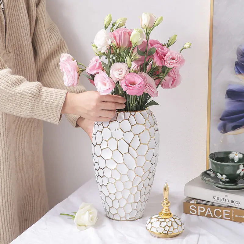 Elegant ceramic vase with a gold accent