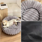 Round donut dog bed made of plush with non-slip bottom