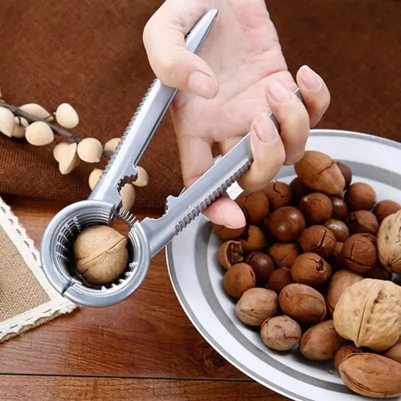Nutoro Nutcracker made of metal | Multifunctional for walnuts, chestnuts, almonds & hazelnuts | Ergonomic handle | Silver