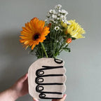 Hand Holding Flowers Vase