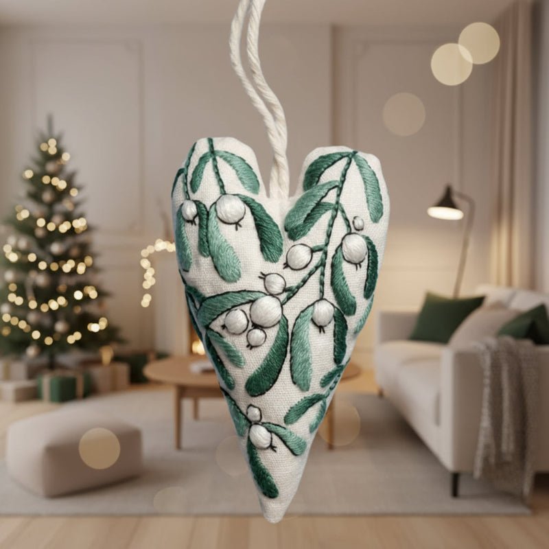 DIY embroidery set for heart-shaped Christmas decorations with fabric, thread, and needles