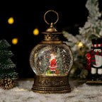 Lunavera Christmas Snow Globe Lantern | Music Box with LED Light & Glitter | Vintage Gold Design | USB & Battery Operated | 21–26 cm