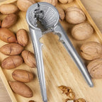 Nutoro Nutcracker made of metal | Multifunctional for walnuts, chestnuts, almonds & hazelnuts | Ergonomic handle | Silver