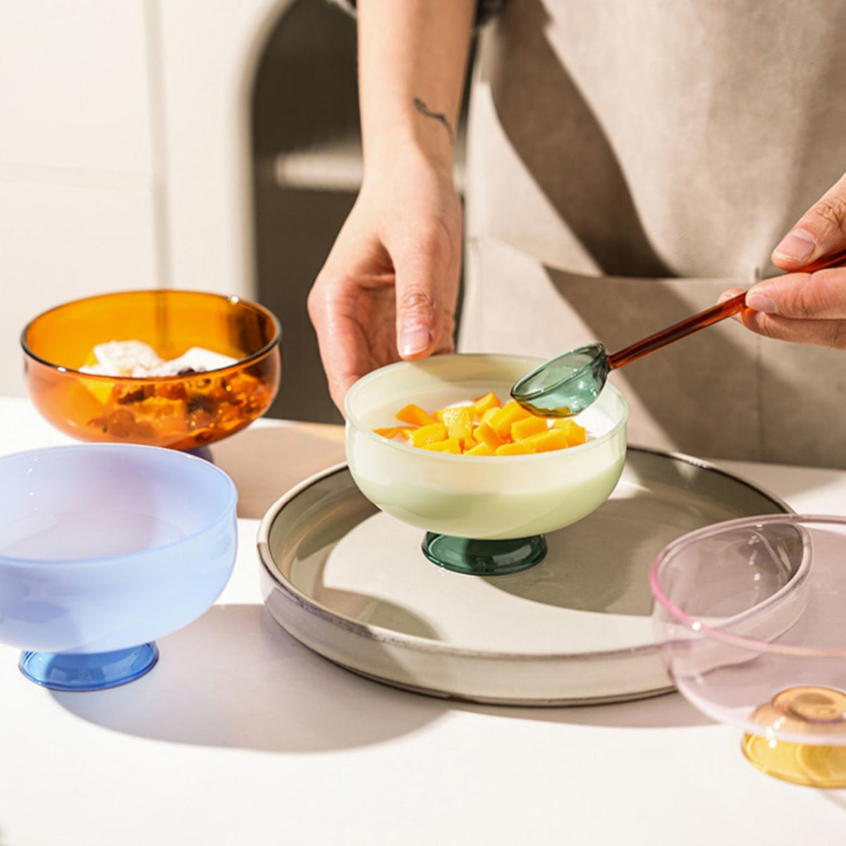 Colorful borosilicate dessert bowl with spoon