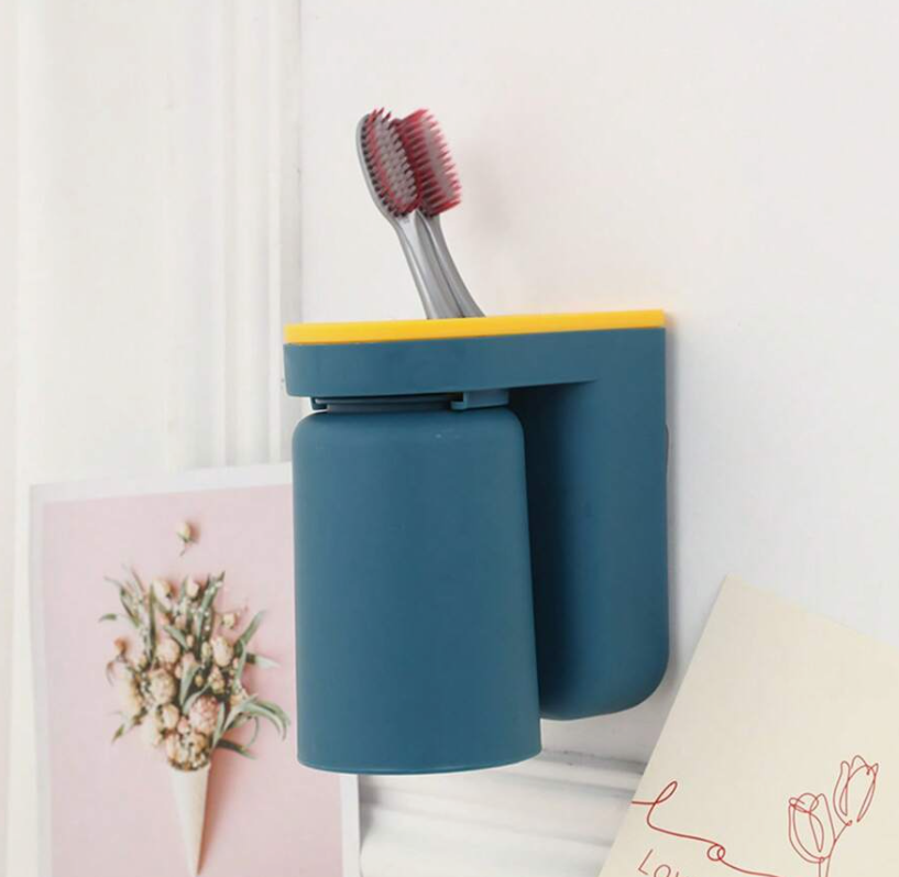 Adhesive toothbrush holder