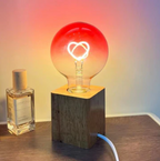 Pink LED light bulb with heart pattern – gradient