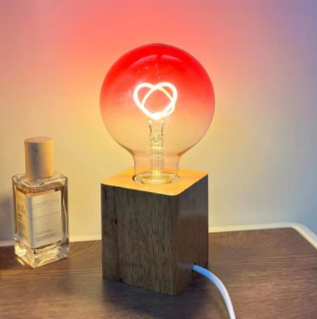 Pink LED light bulb with heart pattern – gradient