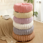 Round donut dog bed made of plush with non-slip bottom