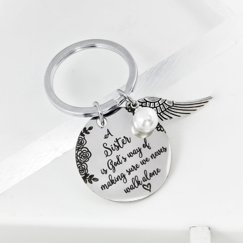 A sister is God's way of making sure we never walk alone keychain