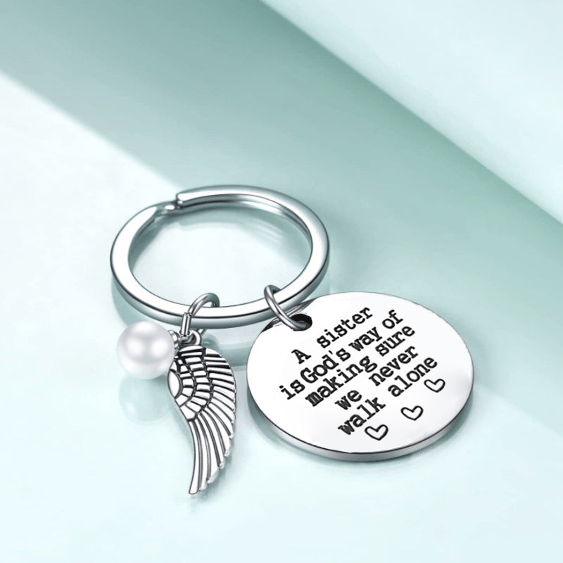 A sister is God's way of making sure we never walk alone keychain