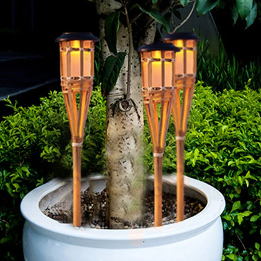 Solar-powered garden torches in bamboo design – Weatherproof LED decorative lighting for outdoors