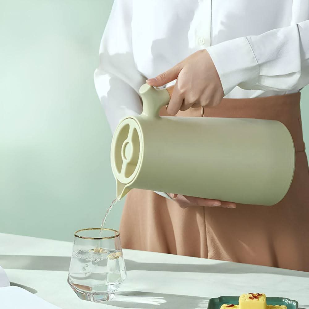 Elegant double-walled glass carafe with wooden handle for hot and cold drinks