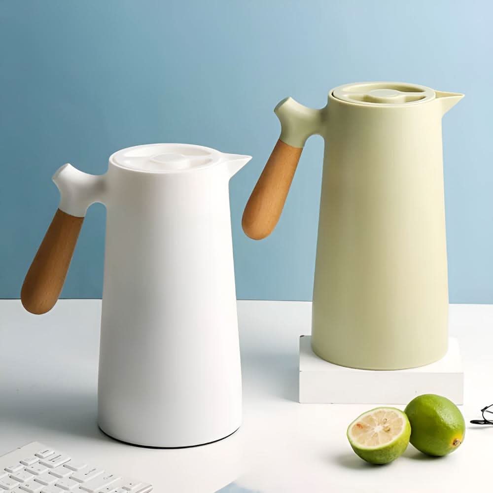 Elegant double-walled glass carafe with wooden handle for hot and cold drinks