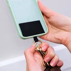 Versatile phone strap with card slot and storage pouch