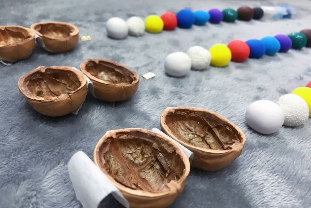 Handcrafted dollhouse made from walnut shells with interior light