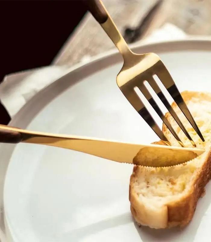 Premium stainless steel cutlery with wood accent