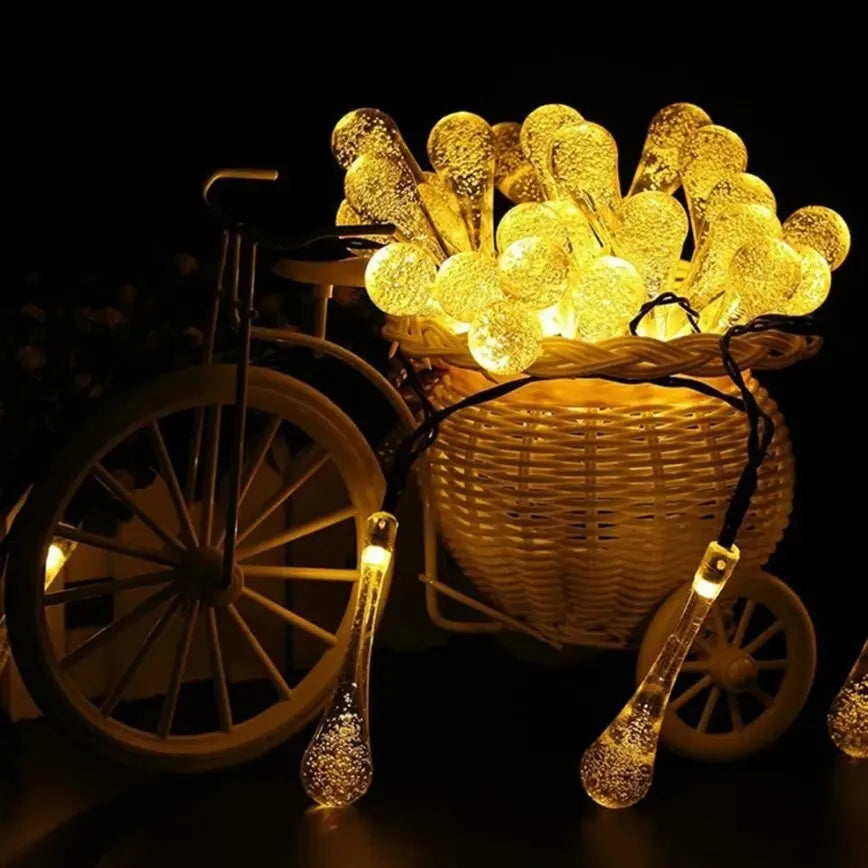 Solar-powered dew drop string lights for garden, waterproof LED decorative lighting for outdoor areas
