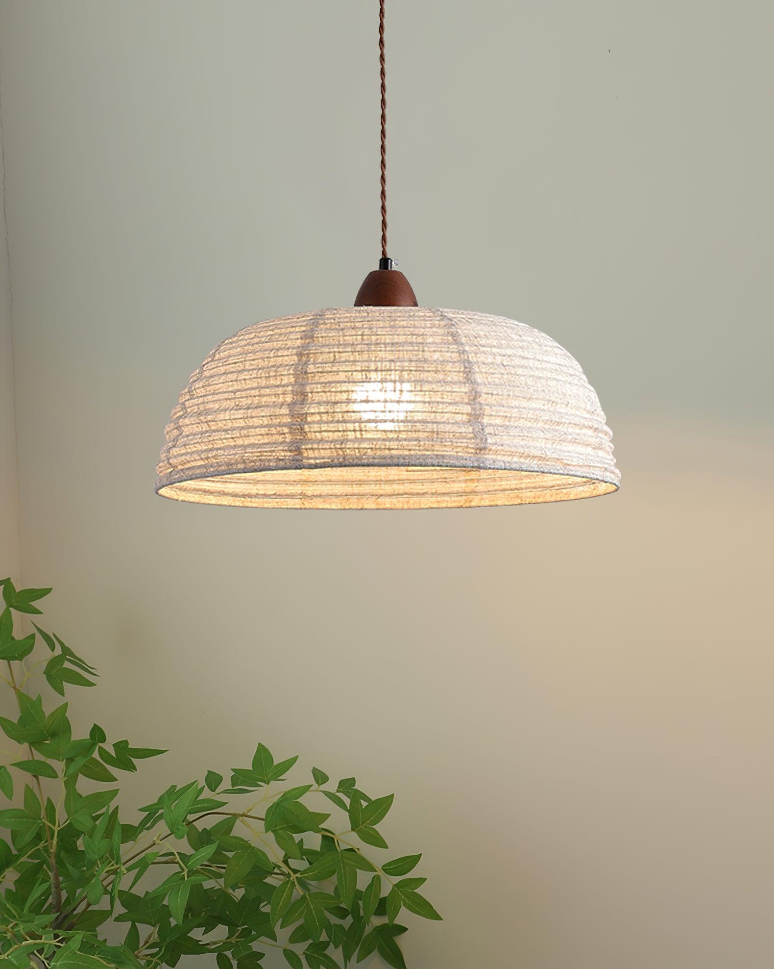 Pendant lamp with natural materials and subtle light
