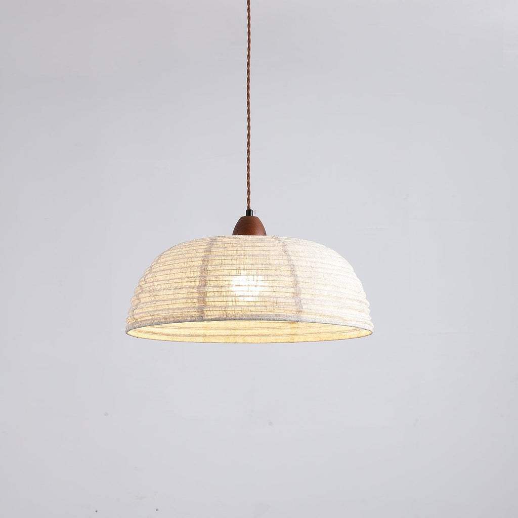 Pendant lamp with natural materials and subtle light