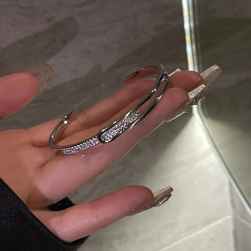 Open bracelet made of 925 sterling silver with zirconia