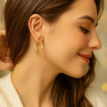 Elegant Gold Colored Twisted Hoop Earrings with Mesh Pattern