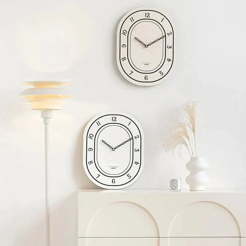 Silent Oval Wall Clock with Roman Numerals Design