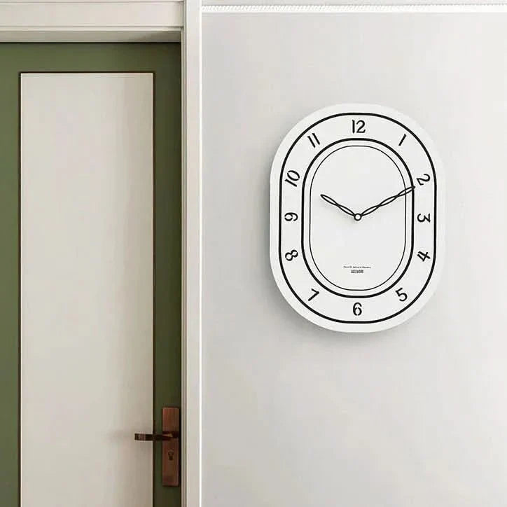 Silent Oval Wall Clock with Roman Numerals Design