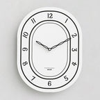 Silent Oval Wall Clock with Roman Numerals Design