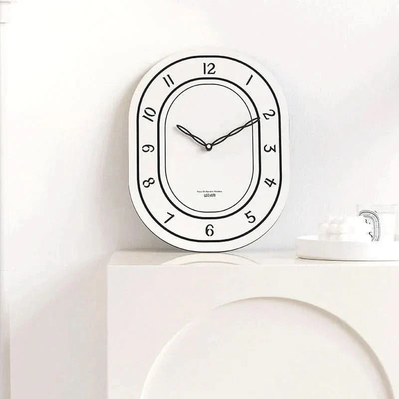 Silent Oval Wall Clock with Roman Numerals Design