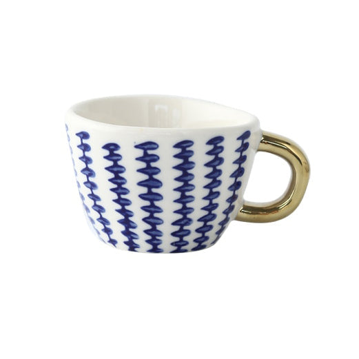 Cup with abstract geometric pattern and gold handle