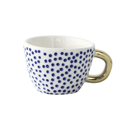 Cup with abstract geometric pattern and gold handle