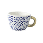 Cup with abstract geometric pattern and gold handle