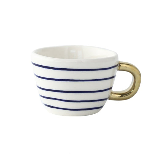 Cup with abstract geometric pattern and gold handle