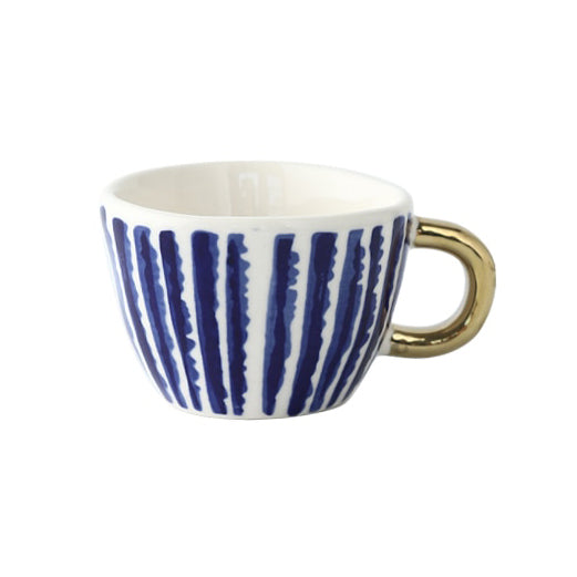 Cup with abstract geometric pattern and gold handle