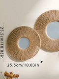 Round decorative wall mirror in boho style with woven hemp rope
