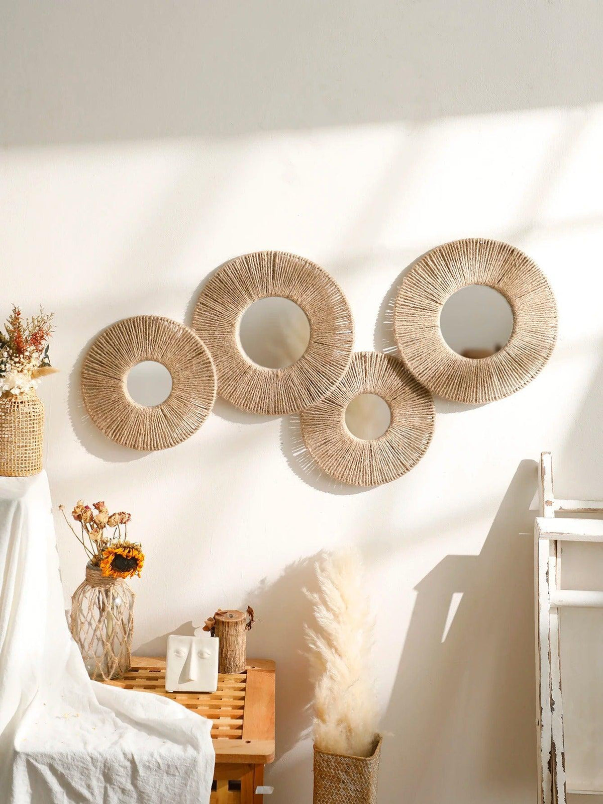Round decorative wall mirror in boho style with woven hemp rope