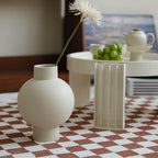 Elegant minimalist design with a smooth, curved silhouette