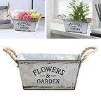 Decorative flower and garden container made of metal with hemp rope handles